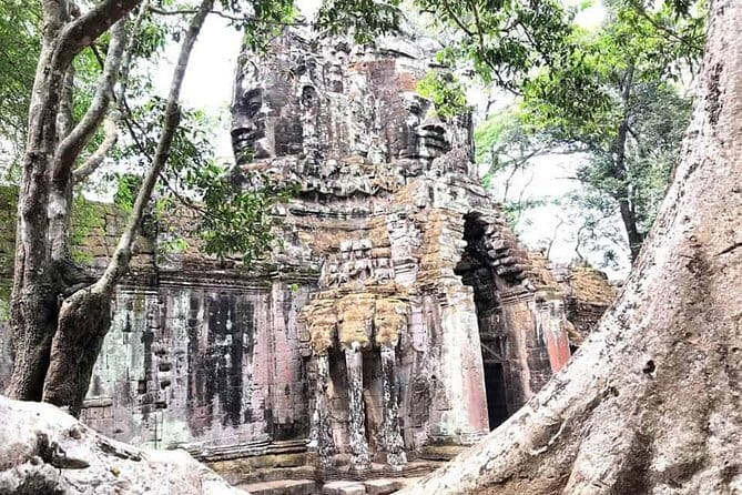 1-Day Angkor Wat Cycling Tour: Scenic Bike Adventure in Siem Reap - Angkor Thom and the Bayon’s stone faces