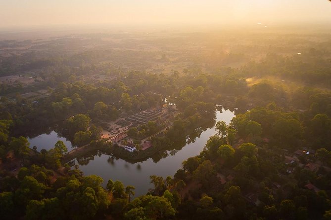 3-Day Angkor, Lake-side Village & Roluos Temples Tour - Day One: Stone Faces, Jungle Roots, and Angkor Wat