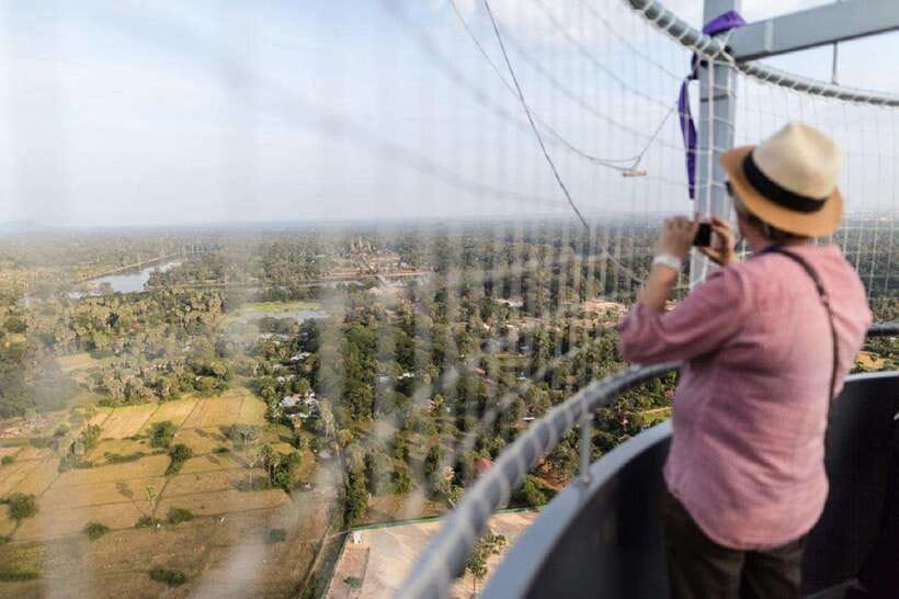 Angkor Balloon Sunrise or Sunset ride and Pick up/Drop off - Rising beside Angkor Wat, not over the temple