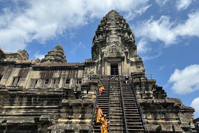 Angkor Sunrise Bike Tour with Lunch Included - Bayon’s carved faces and daily life