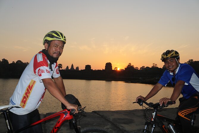 Angkor Sunrise Expedition Cycling Through Serene Backroads - Along the Angkor Thom wall