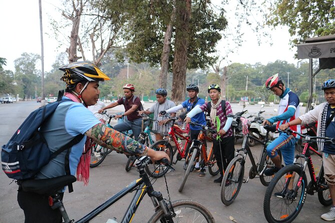 Angkor Sunrise Expedition Cycling Through Serene Backroads - Bayon and its famous stone faces