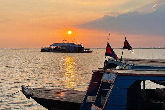 Angkor Sunrise & Floating Village Sunset Full-Day Siem Reap Tour - Ta Prohm and the roots over the stones