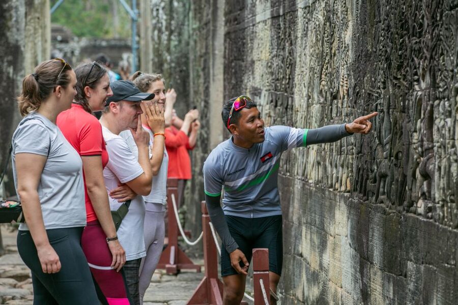 Angkor Wat: Guided Sunrise Bike Tour w/ Breakfast and Lunch - Angkor Thom and Bayon, stone faces in the forest