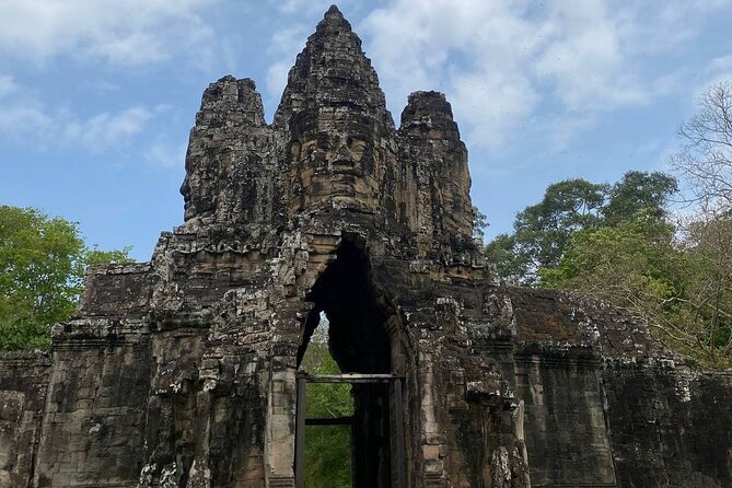 Angkor Wat Sunrise & Highlight The Most Iconic Temple - Ta Prohm and the trees over the stones