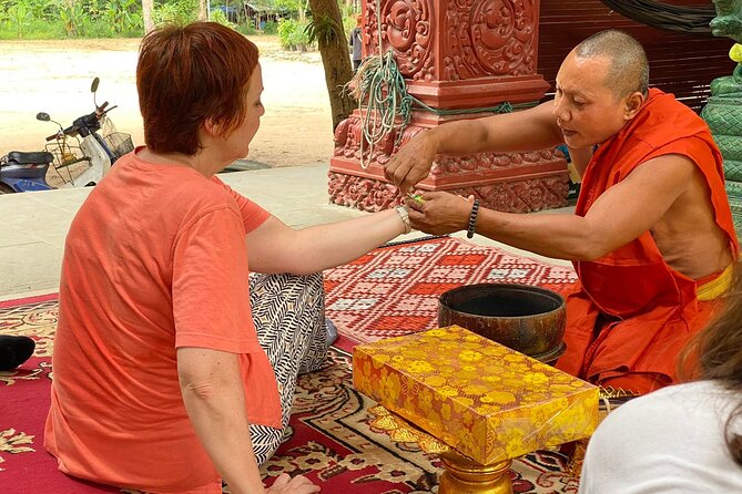 Buddhist Monastery with Monks Water Blessing - What the water blessing means in Cambodia