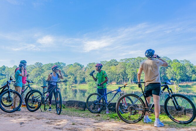 Cycle the Angkor Backroads with lunch / E-Bike or Tuk Tuk - Ta Prohm beneath the jungle trees