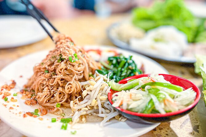 Old Siem Reap Sunset Food Tour by Tuk-tuk - Yi Nget beef sticks and the street-food story