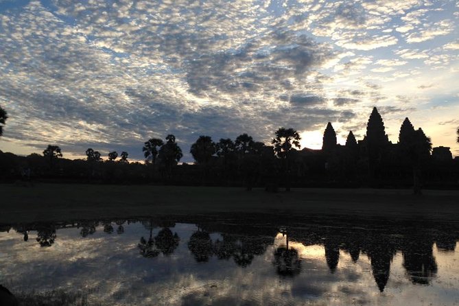 One Day tour with sunrise in car with A/C or Van & Guide. - Bayon and the ancient city of Angkor Thom