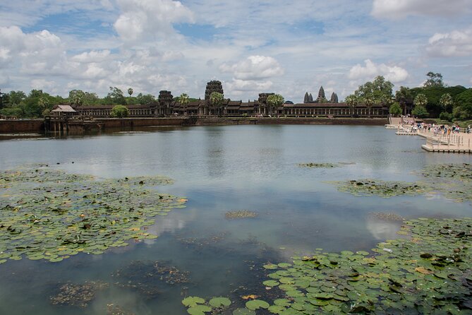 Private Sunrise Angkor Wat Tour with pickup from your hotel - Ta Prohm, where trees claim the ruins
