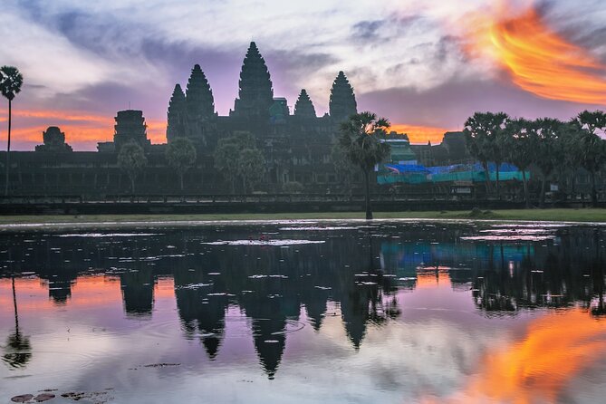 Private Sunrise Angkor Wat Tour with pickup from your hotel - South Gate of Angkor Thom and the faces of Bayon