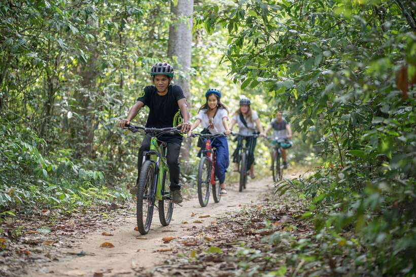 Siem Reap: Angkor Temples Off-Track Bicycle Tour - Angkor Wat’s wall and the first ride through the park