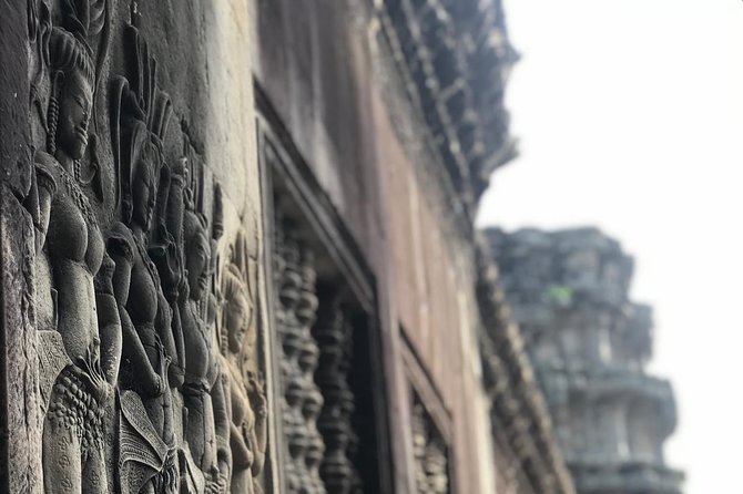 Siem Reap: Angkor Wat Sunrise Explore The Most Iconic Temples - Bayon places giant stone faces at the center
