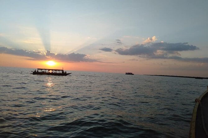 Sunset Dinner and drinks includes a Floating Village cruise tour. - Boarding the Queen Tara for sunset