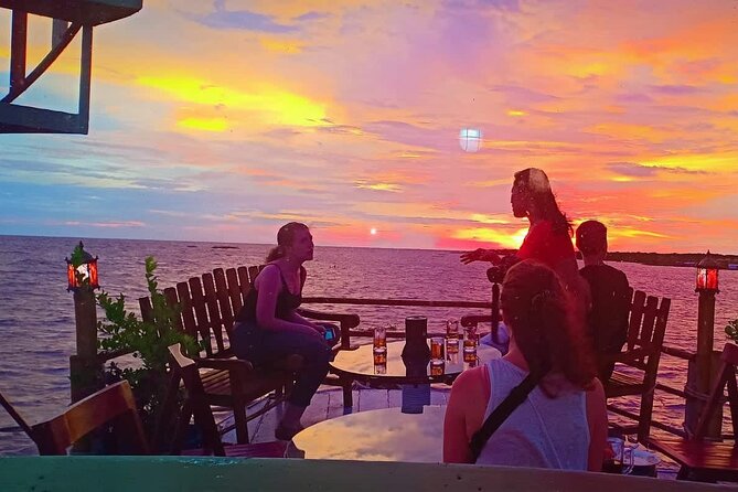 Sunset Dinner and drinks includes a Floating Village cruise tour. - The crocodile and fish farm stop